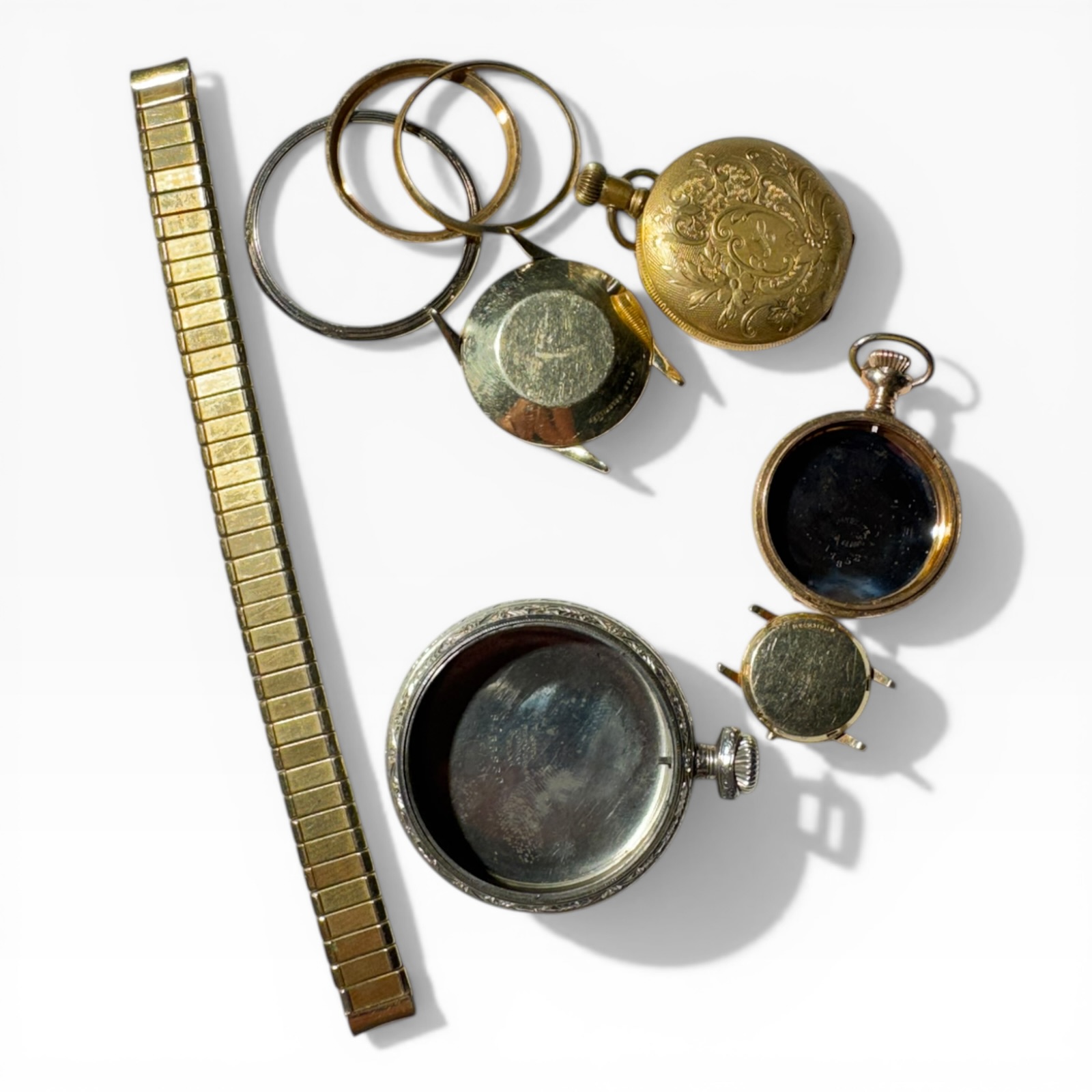 Examples of gold-filled scrap — pocket watches, watch cases, and vintage jewelry findings